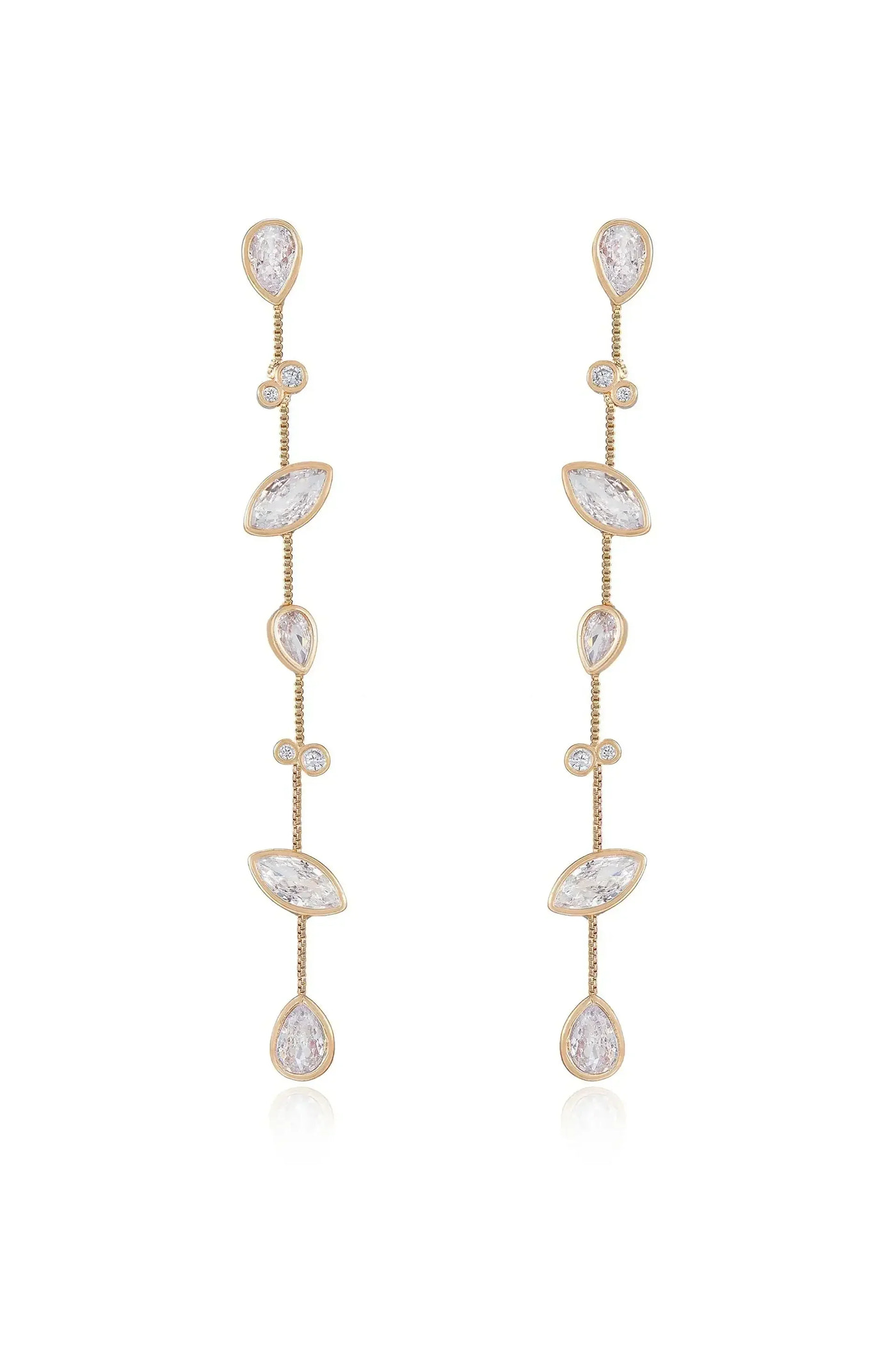 Dazzling gold earrings feature a series of shimmering gemstones arranged in a vertical design, creating an elegant, cascading effect against a neutral background.