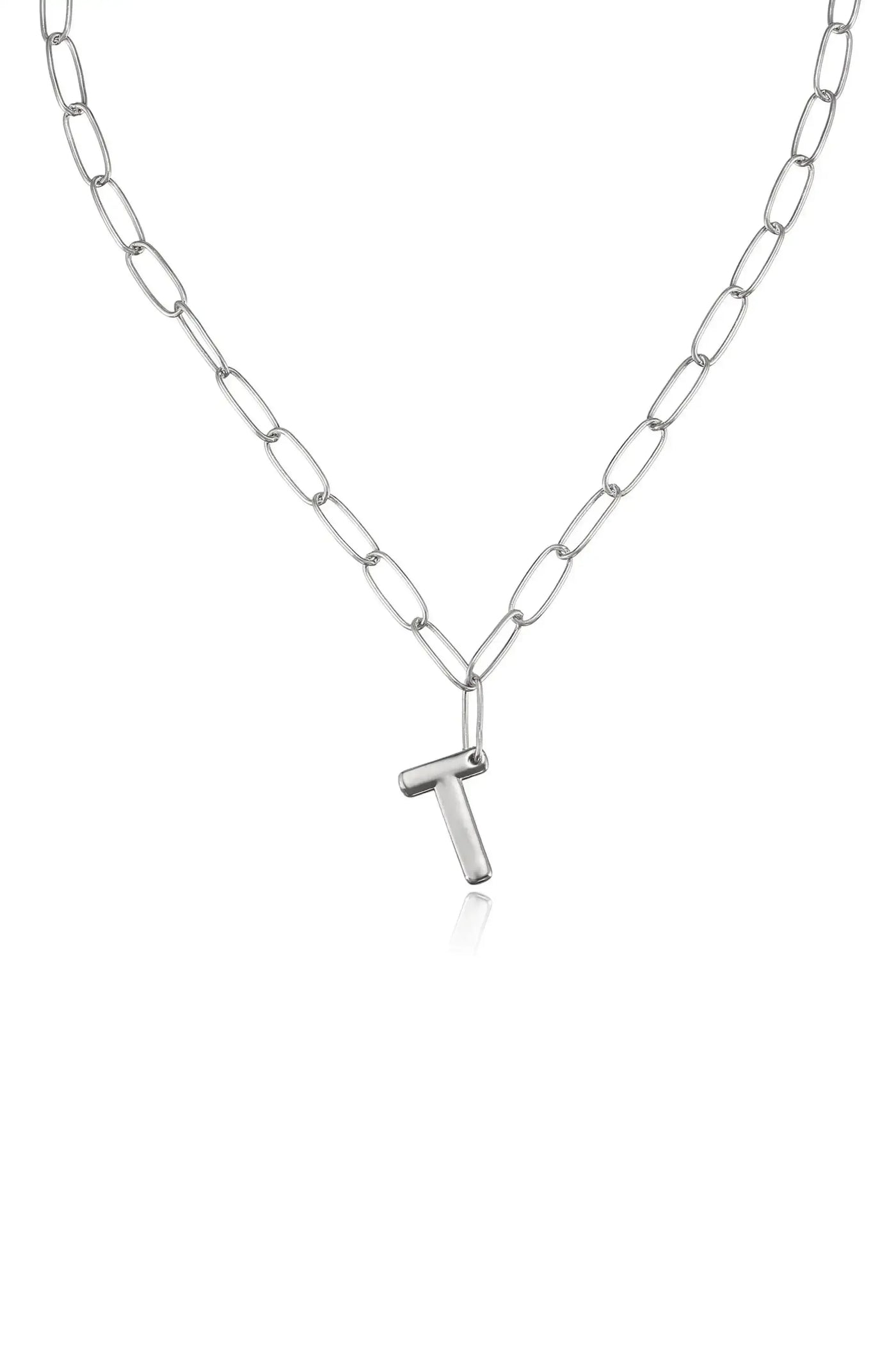 A silver chain necklace features elongated links and a prominent 'T' shaped pendant, showcasing a simple and modern design against a plain white background.