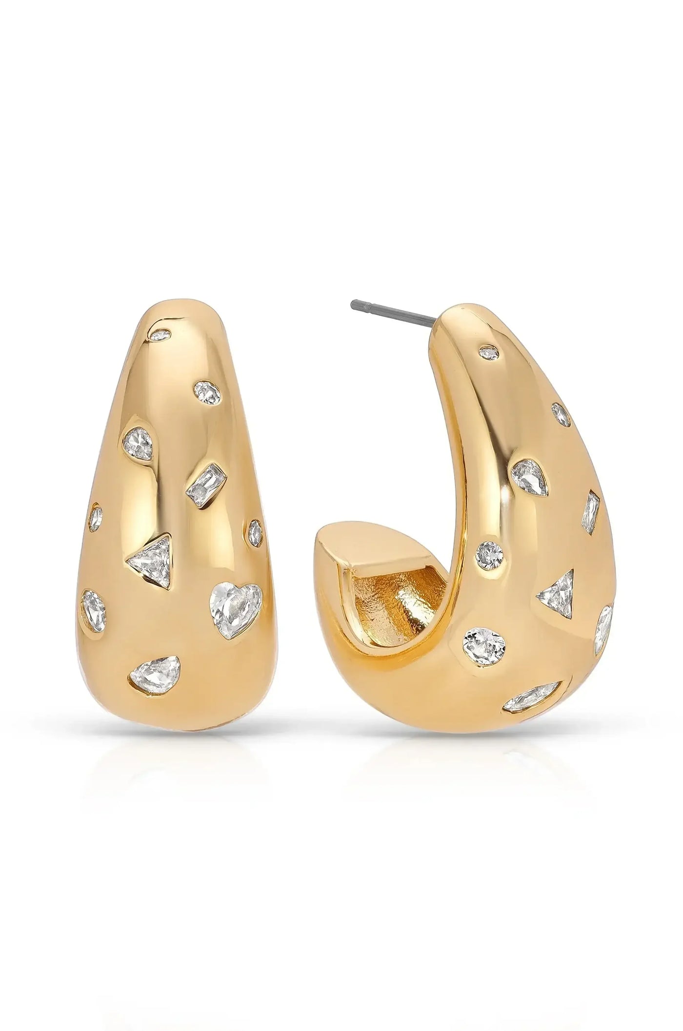 Gold earrings with a smooth, rounded shape feature variously cut diamond-like stones embedded in their surface. They sit against a light background, reflecting a polished finish.