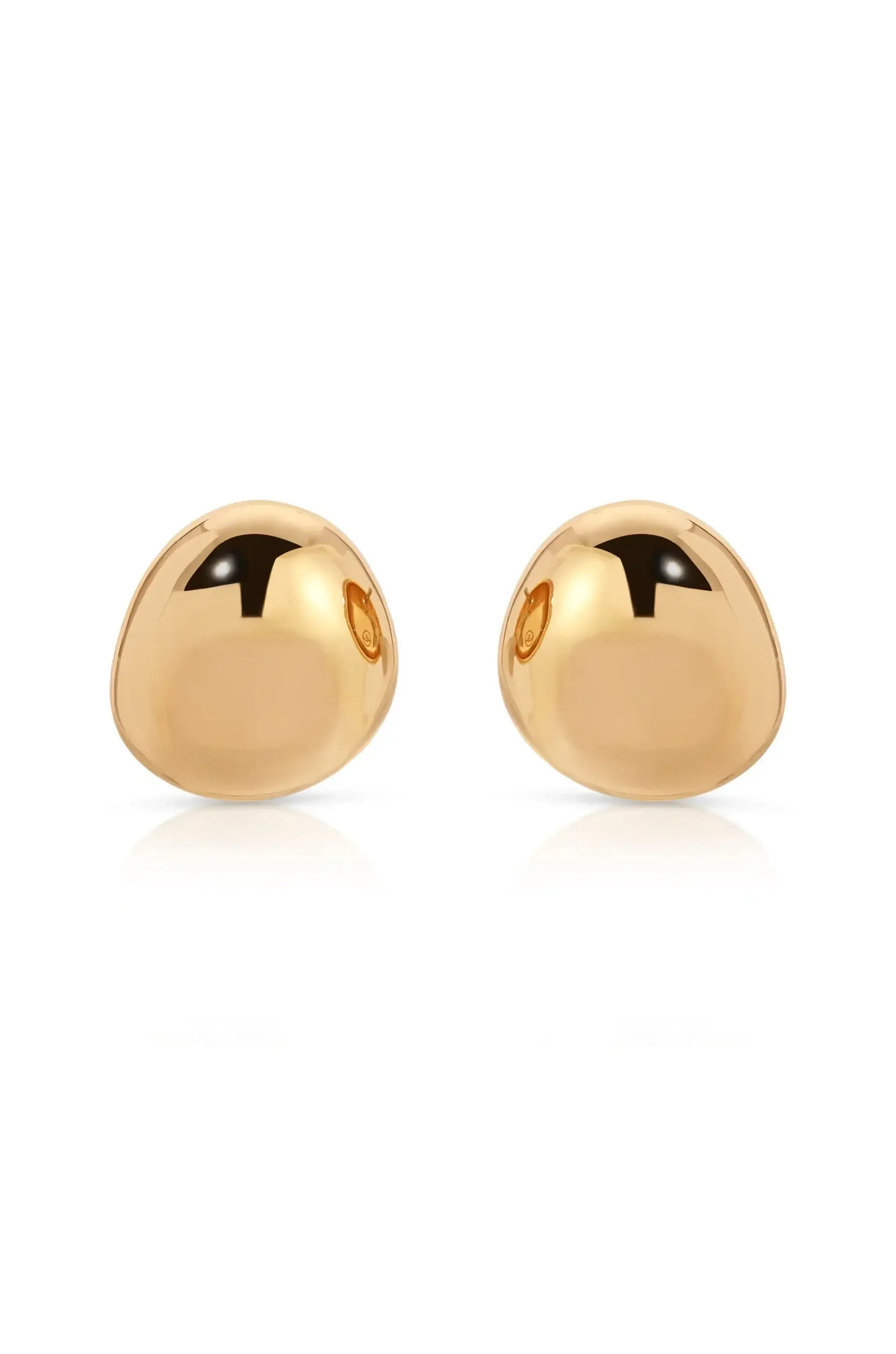 Two polished gold dome-shaped earrings are positioned symmetrically, reflecting light and casting soft shadows on a white background, creating an elegant and minimalist presentation.