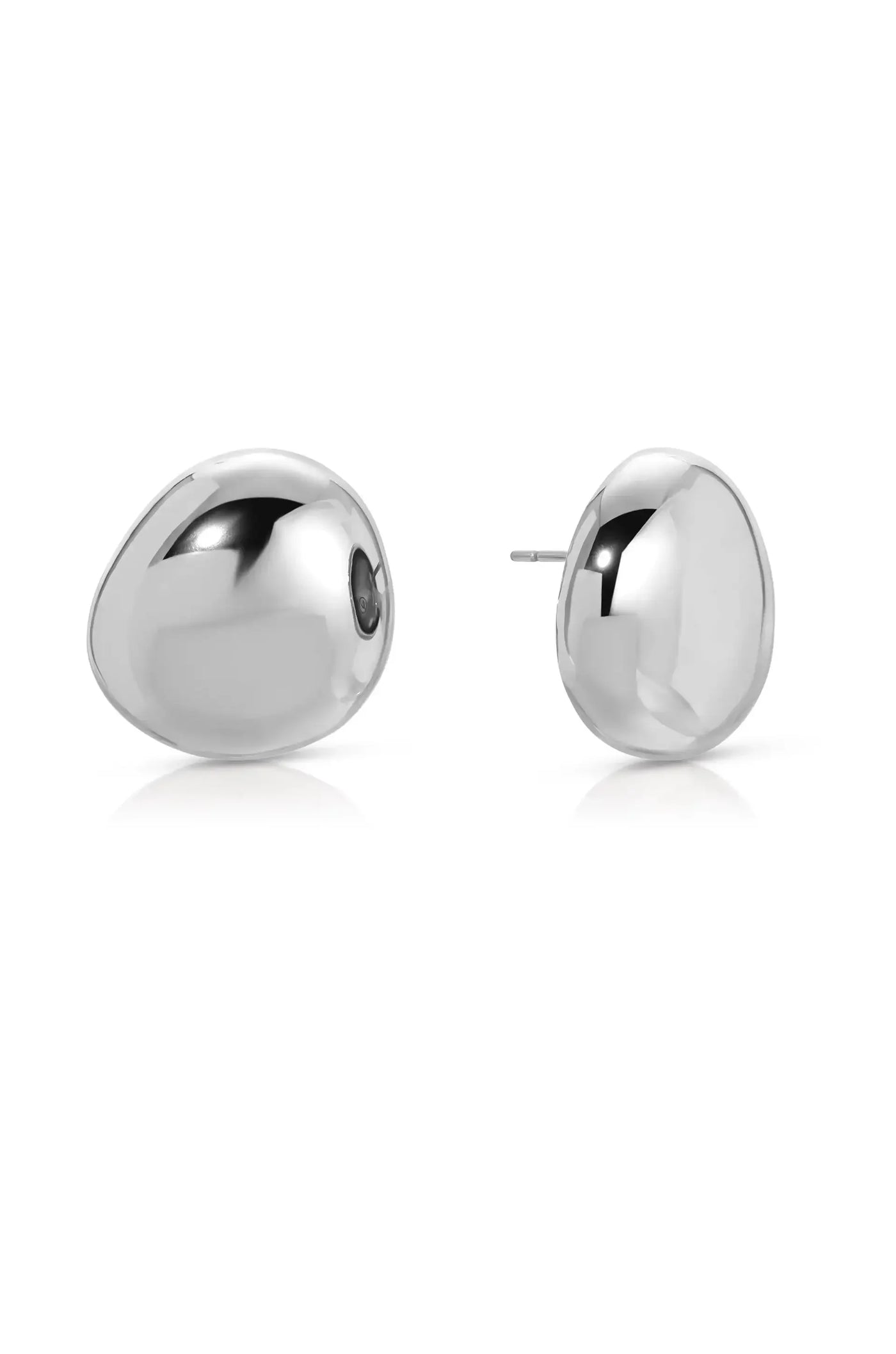 Two polished silver earrings feature a smooth, rounded design. They are positioned closely, with one revealing a post for secure attachment, set against a clean, white background.