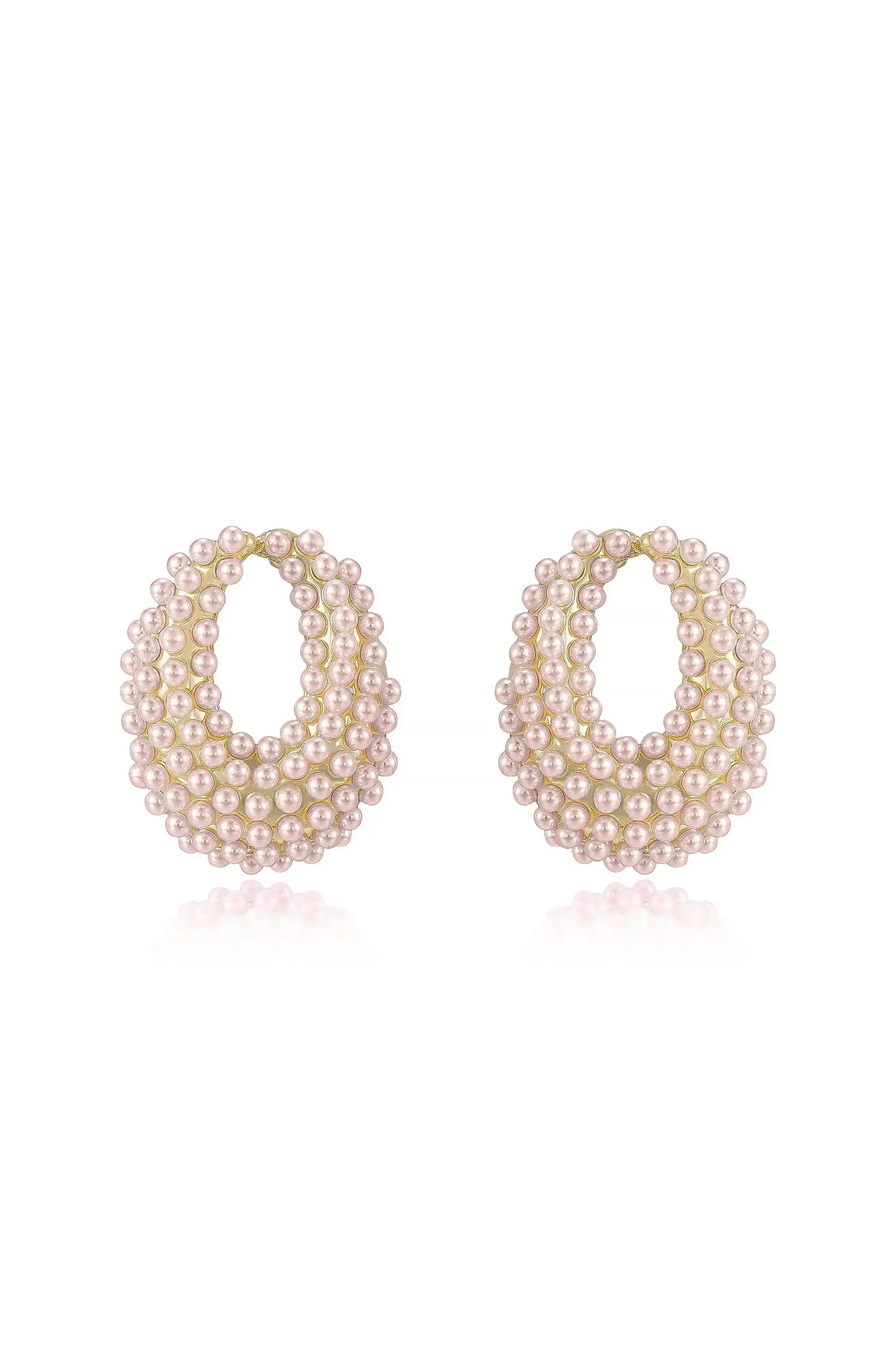 A pair of elegant earrings, shaped like hoops, features layered strands of small pink pearls. They are displayed on a reflective white surface, emphasizing their shiny quality and intricate detail.