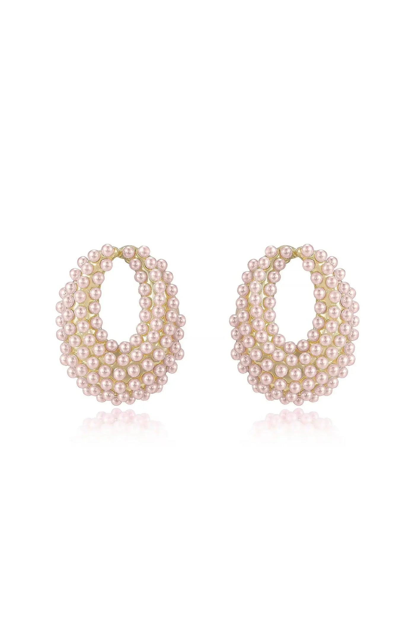 A pair of elegant earrings, shaped like hoops, features layered strands of small pink pearls. They are displayed on a reflective white surface, emphasizing their shiny quality and intricate detail.