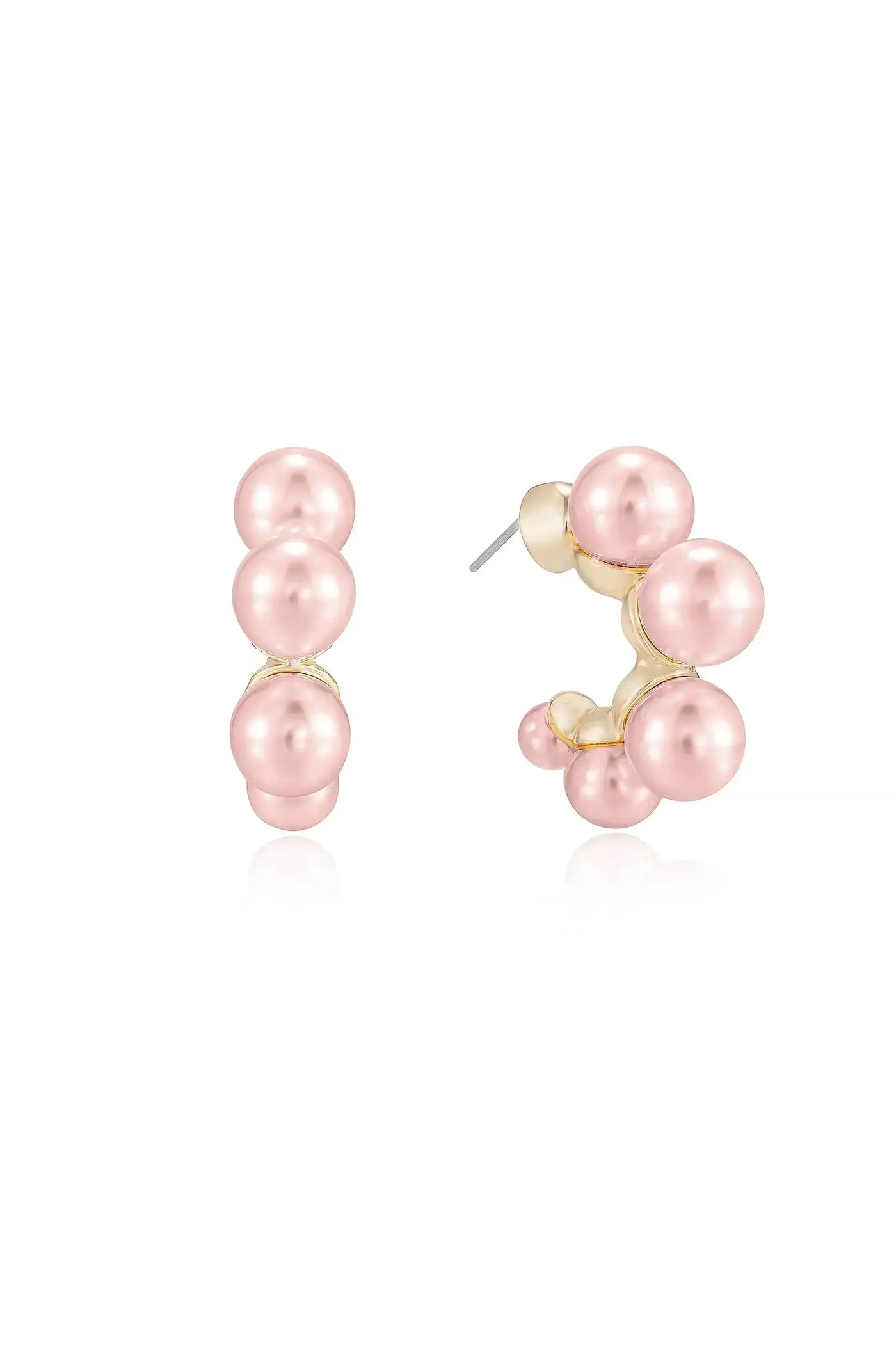 A pair of pink pearl earrings showcases a cluster design, with several graduated-sized pearls mounted on a gold base. They glisten against a plain white background.