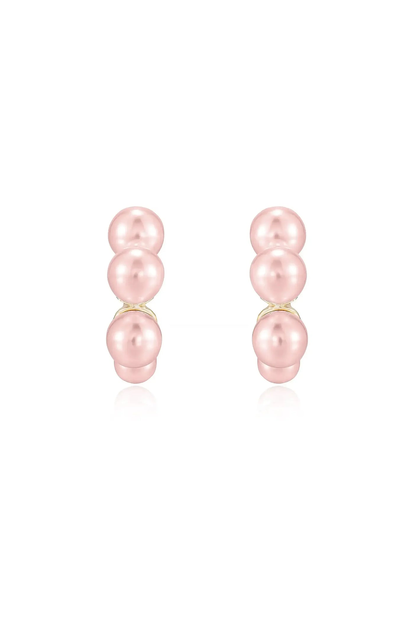 Two pairs of elegant pink pearl earrings are displayed, featuring three round pearls stacked vertically on a gold setting, set against a plain white background.