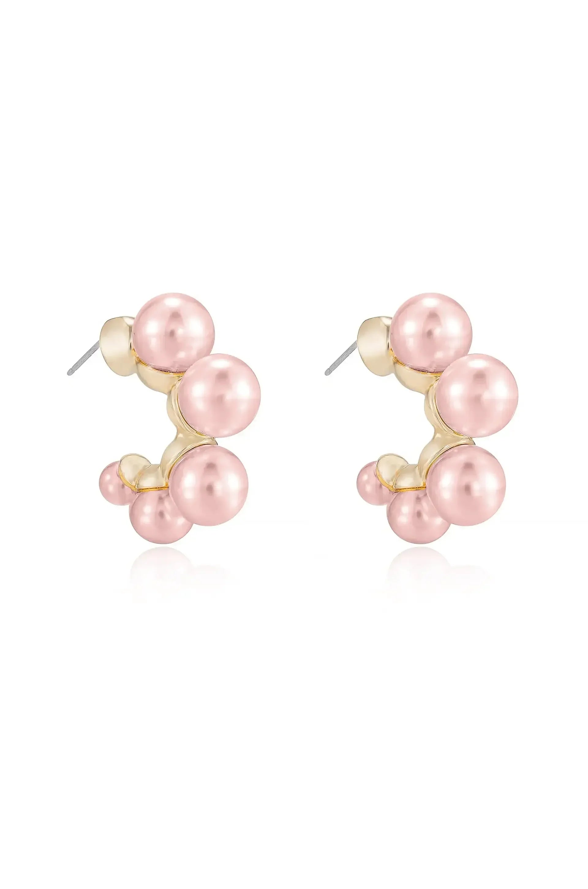 Two stylized earrings featuring clusters of light pink pearls, connected by a gold setting. They are presented against a clean, white background, showcasing their elegance and design.
