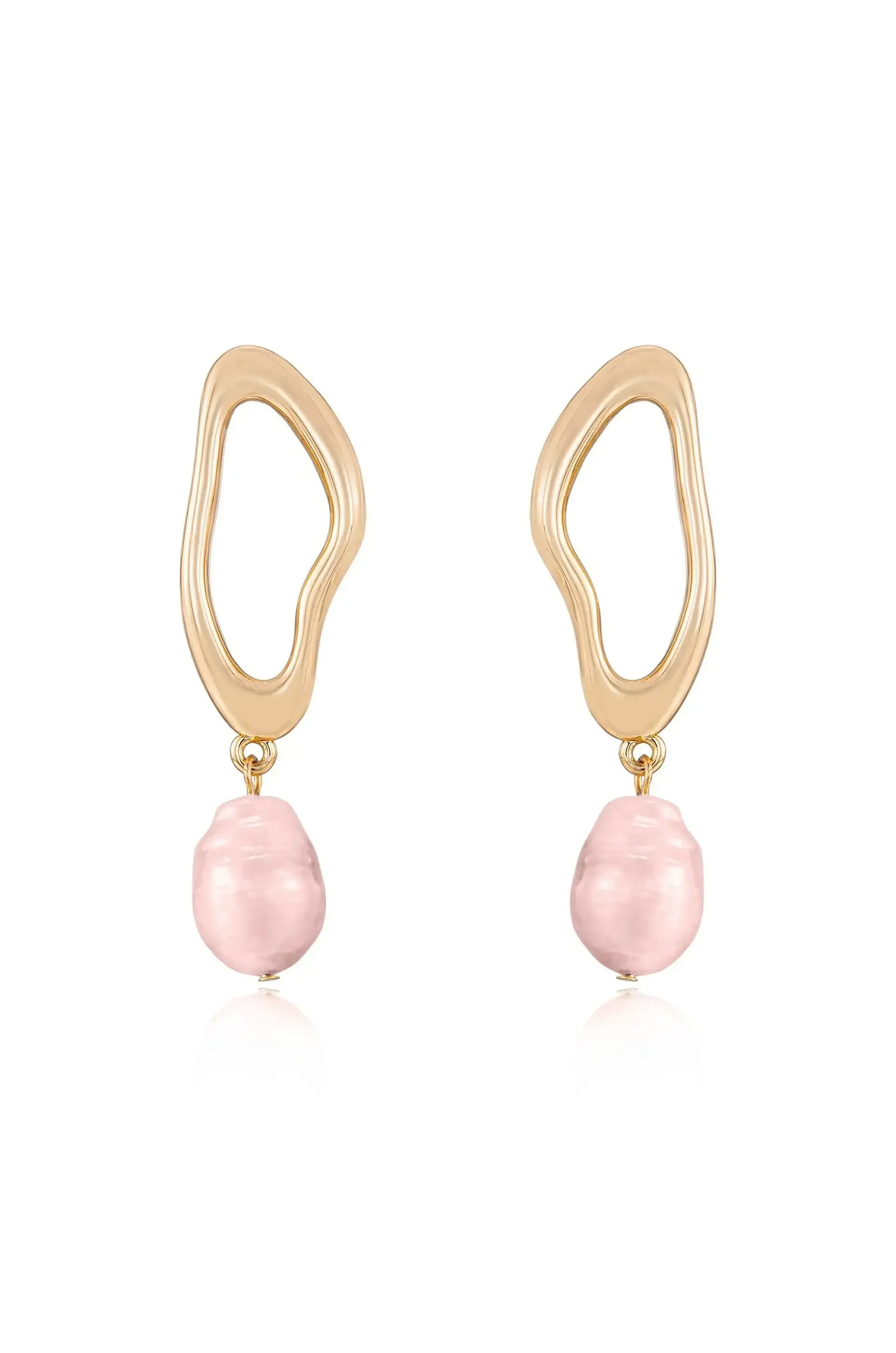 Gold earrings feature a wavy, abstract design holding a pink, irregular-shaped pearl. The earrings hang vertically, showcasing their unique style against a simple, light background.