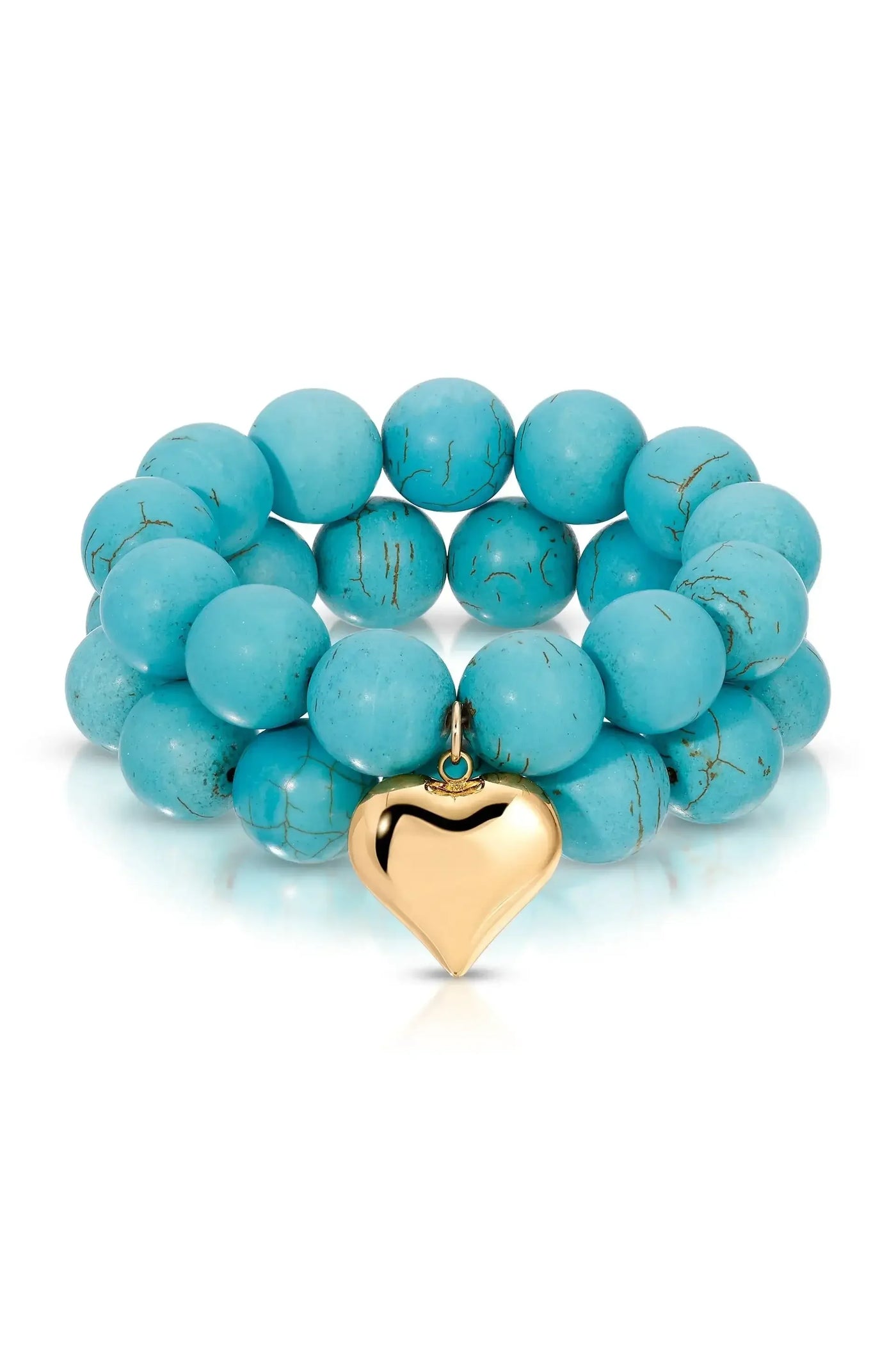 A turquoise beaded bracelet features round beads with a slightly glossy finish and a gold heart charm hanging from it, set against a white background that highlights its color and texture.
