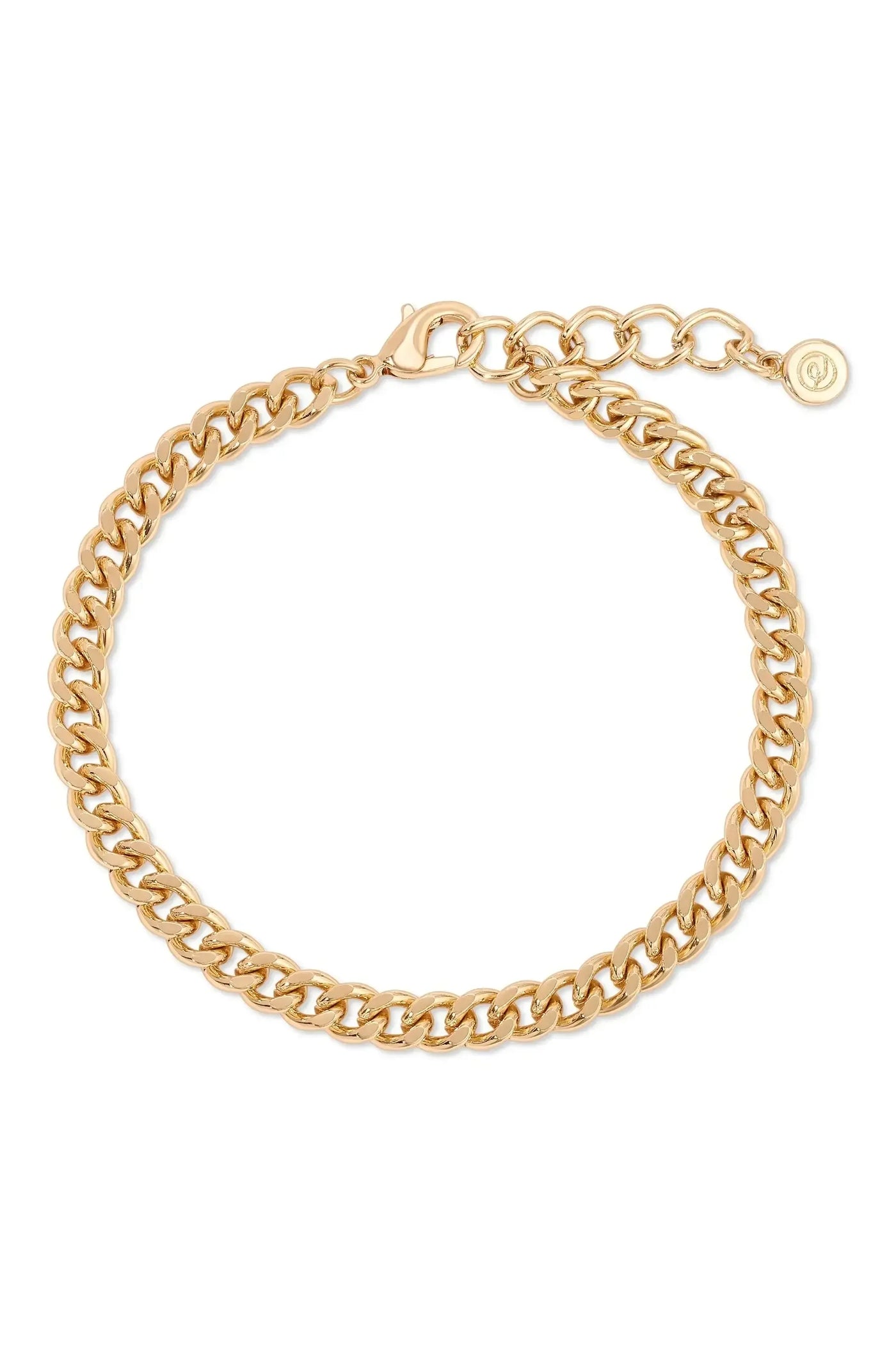A gold chain bracelet rests on a white surface. Its interlocking links create a shiny and polished appearance, with a clasp and an extension chain for adjustable fit.