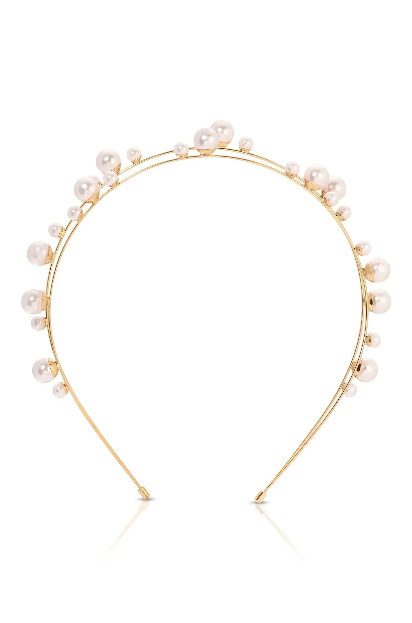 A gold headband adorned with various sizes of pearls sits upright. Its elegant design suggests a decorative accessory suitable for formal or special occasions, positioned against a neutral background.