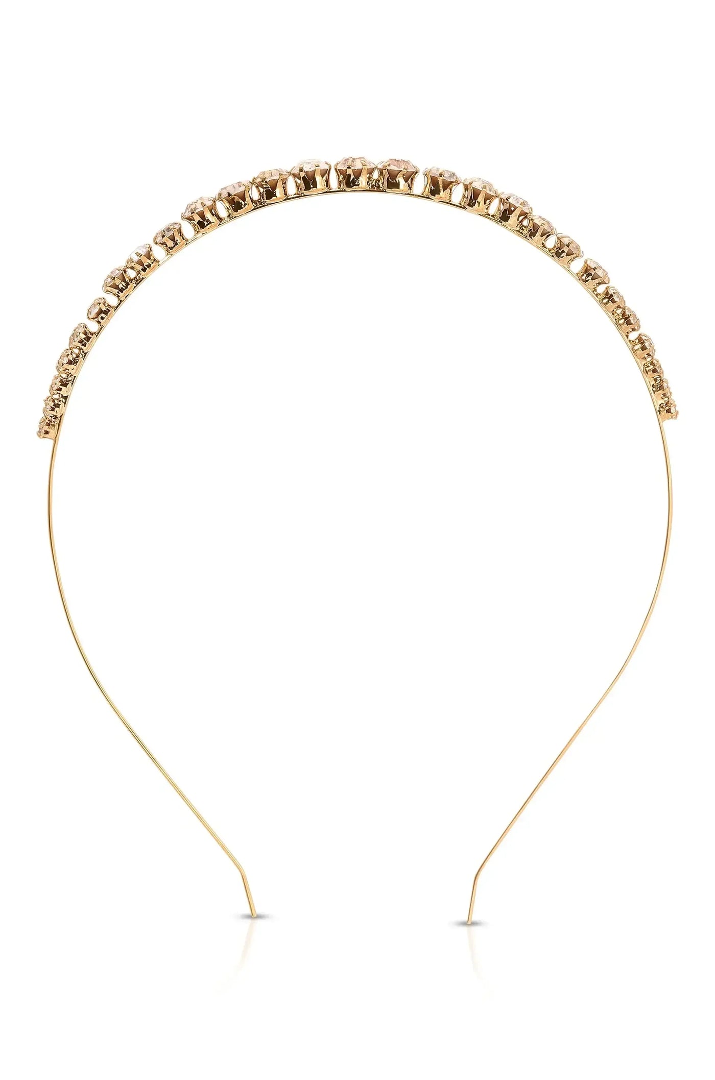 A gold headband adorned with sparkling rhinestones rests horizontally, showcasing an elegant design. It appears against a plain white background, emphasizing its decorative features.