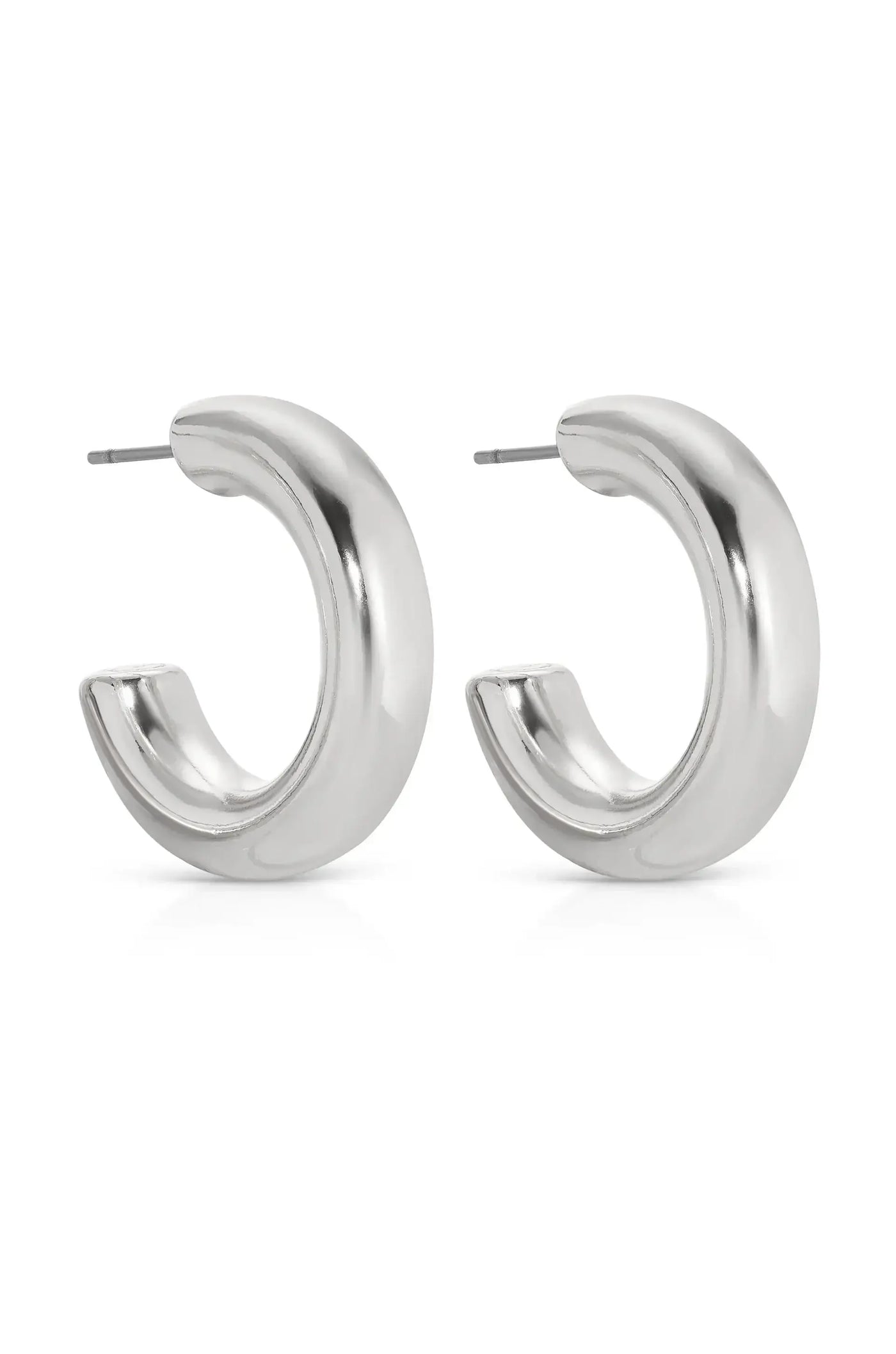 Shiny, silver hoop earrings are displayed side by side, featuring a smooth, curved design. They rest against a plain white background, emphasizing their reflective surface and modern aesthetic.