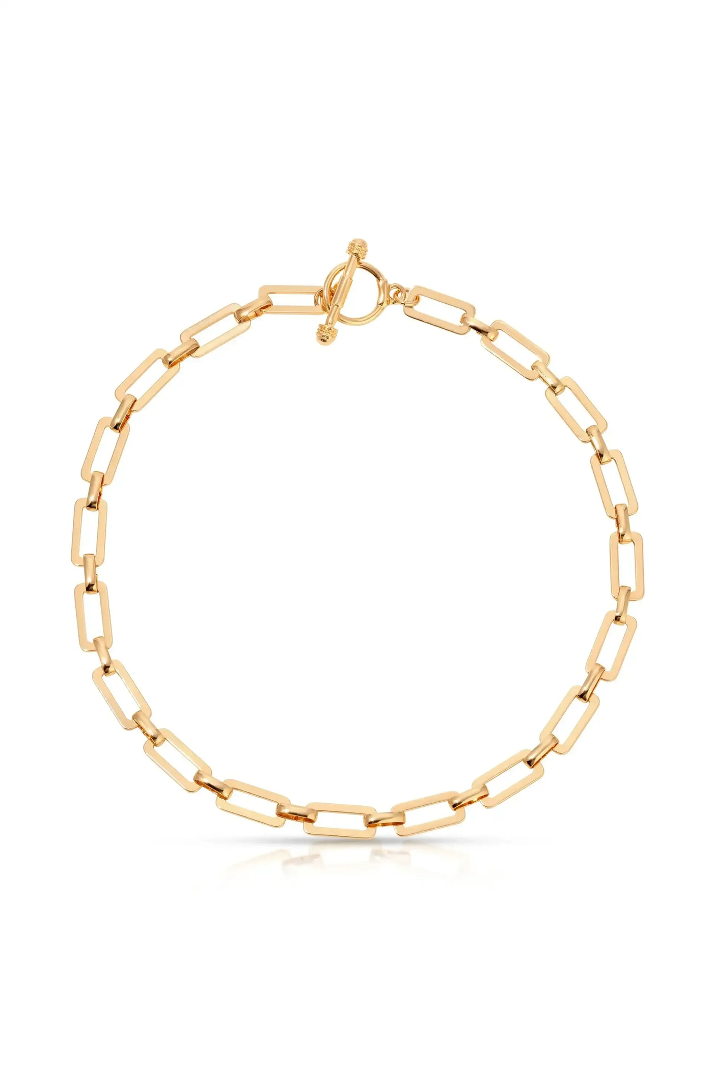 A gold chain bracelet features interlinked rectangular links. It is fastened with a decorative toggle clasp, set against a plain white background, emphasizing its shine and elegance.