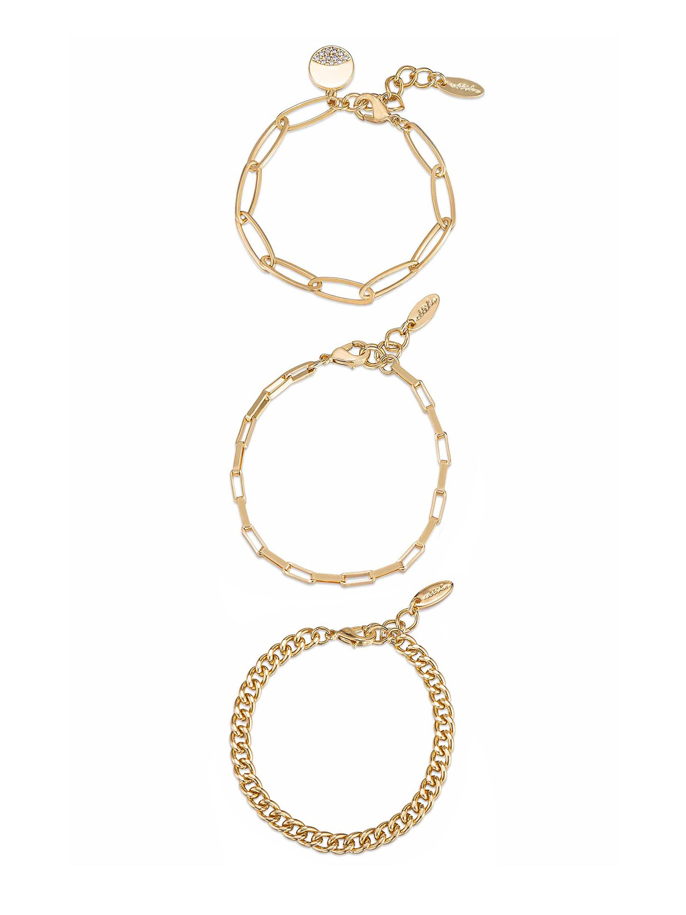 Three gold bracelets are arranged vertically. The top bracelet features a circular charm with a stone, the middle has an elongated link design, and the bottom is a chunky chain style.