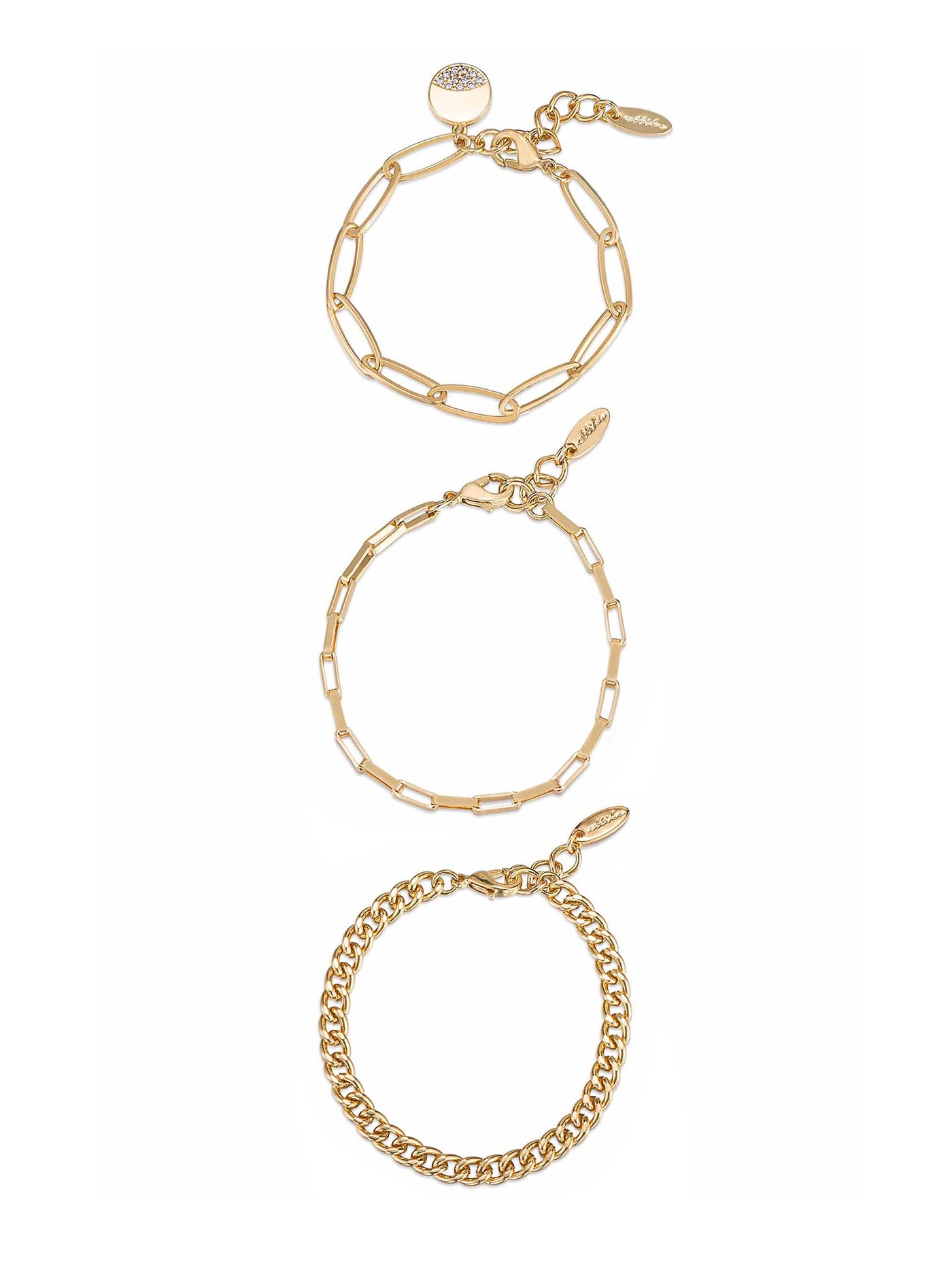 Three gold bracelets are arranged vertically. The top bracelet features a circular charm with a stone, the middle has an elongated link design, and the bottom is a chunky chain style.