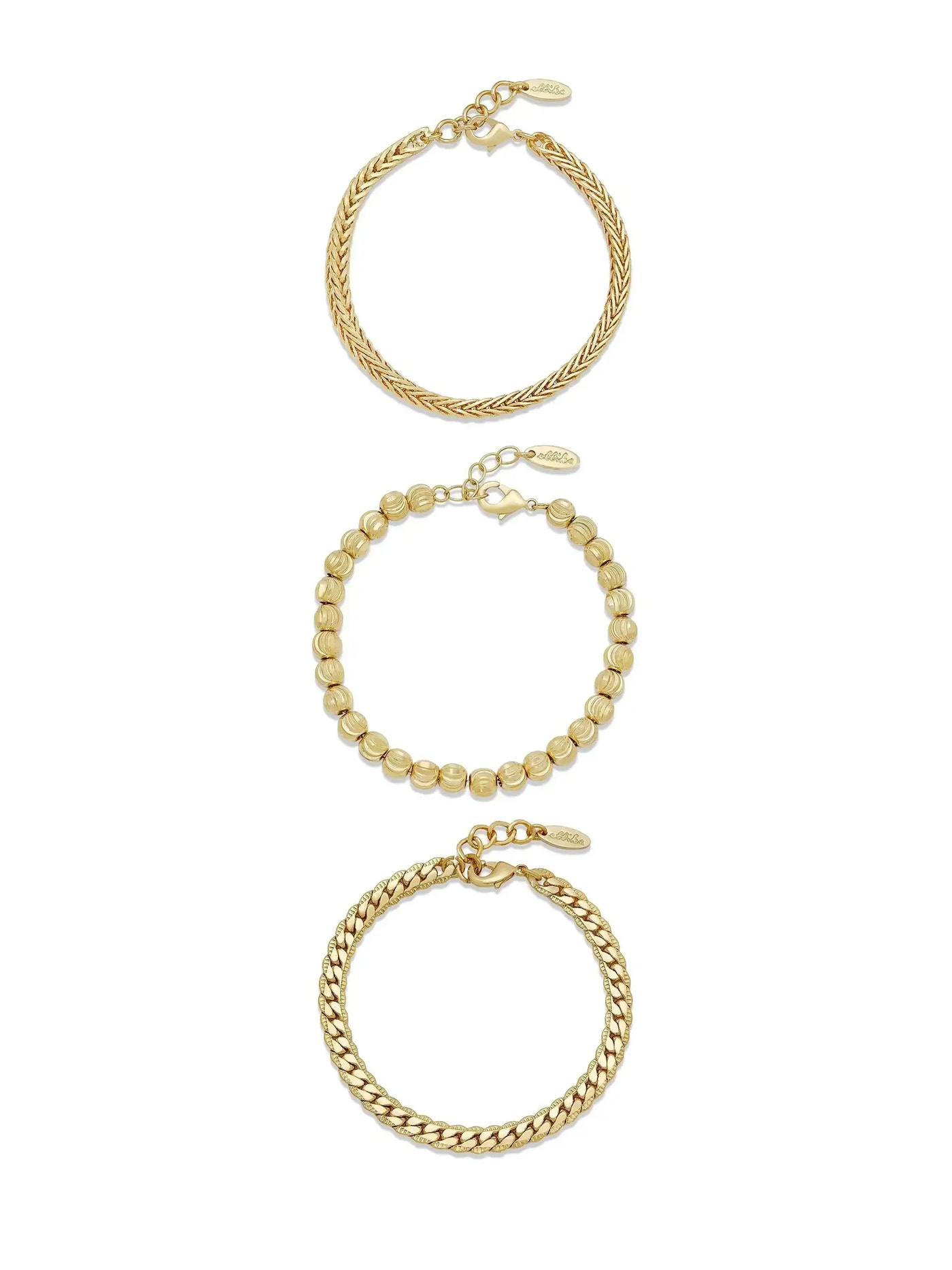 Three gold bracelets are displayed vertically. The top features a twisted design, the middle consists of round beads, and the bottom has a braided structure. They are linked by a chain.