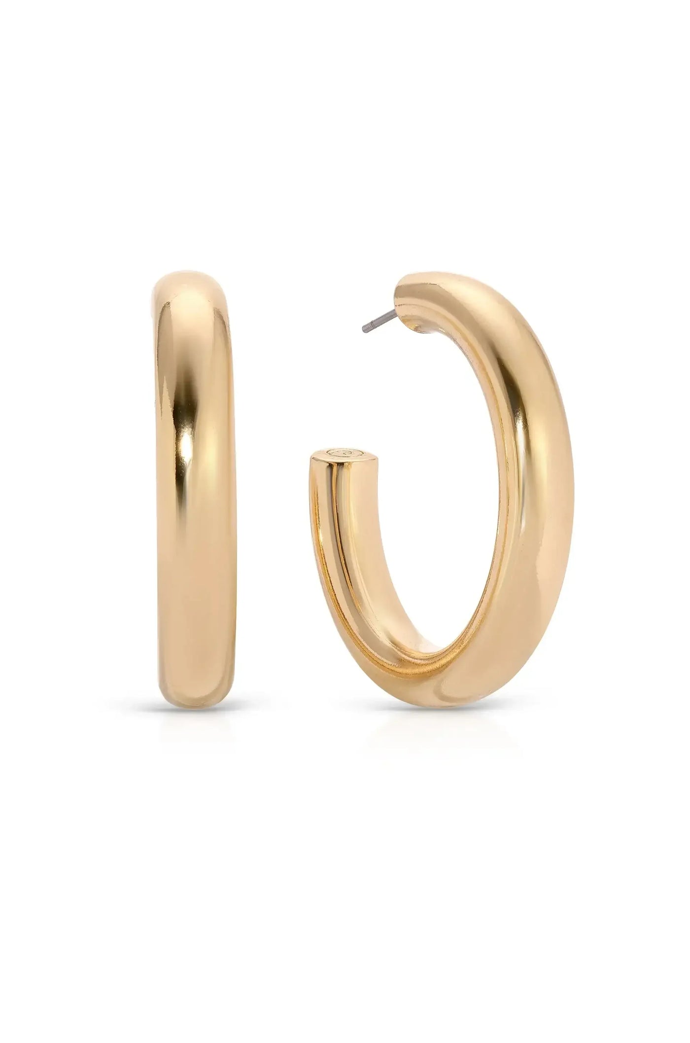 A pair of shiny gold hoop earrings stands prominently, highlighting their smooth, rounded design. The background is plain and neutral, enhancing the earrings' elegant appearance.