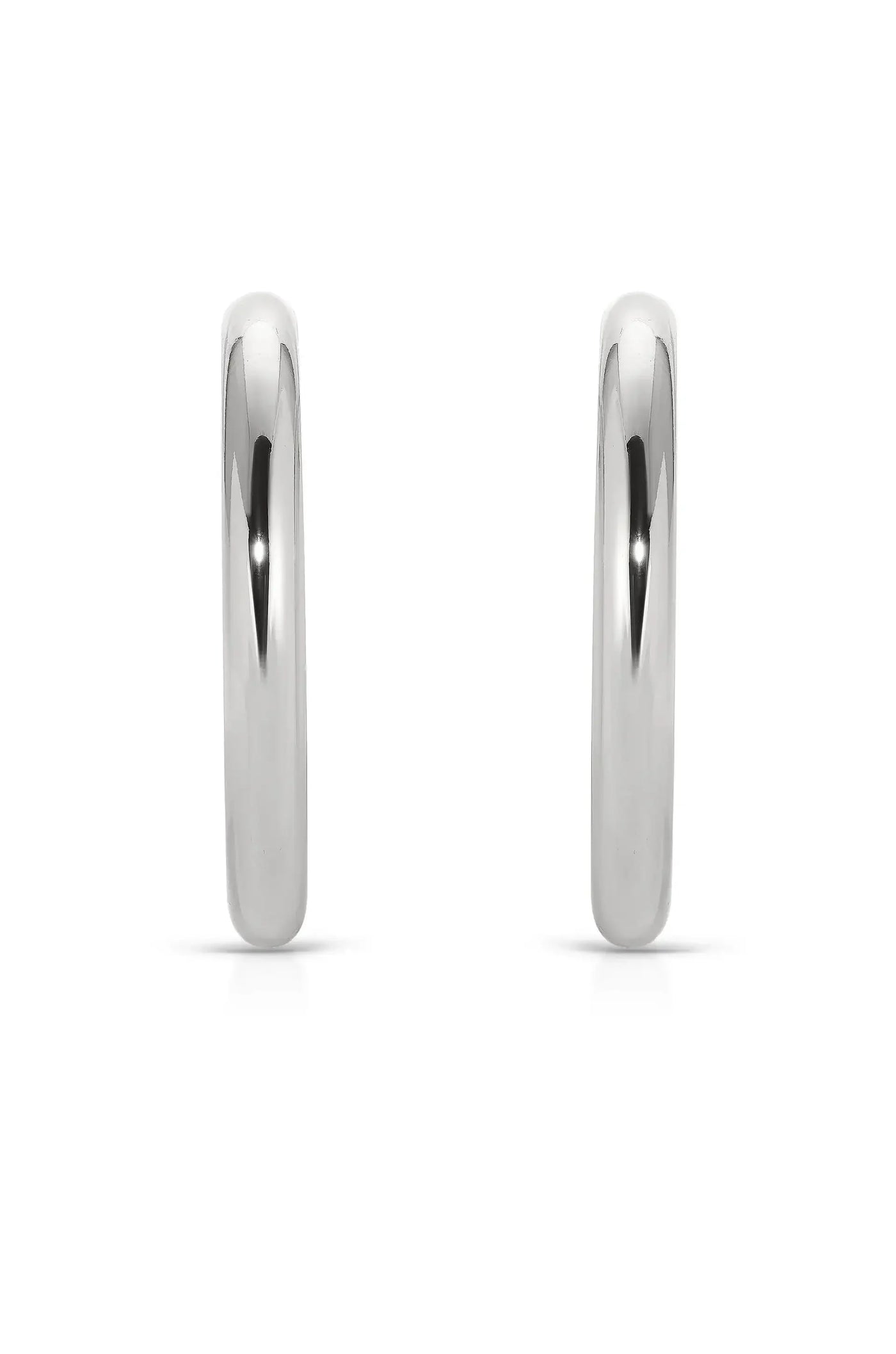 Two shiny, silver hoop earrings are displayed side by side. They are evenly spaced, showcasing their smooth, reflective surfaces against a plain white background.
