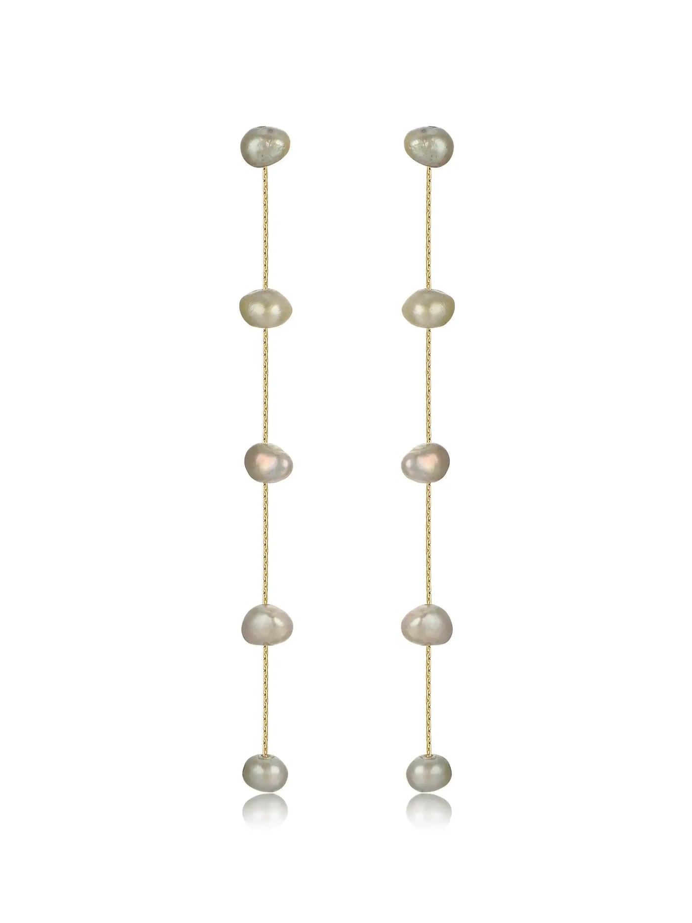 Two delicate earrings hang vertically, featuring a series of irregularly shaped pearls strung on thin gold chains, with a smooth, reflective surface enhancing their elegance against a plain background.