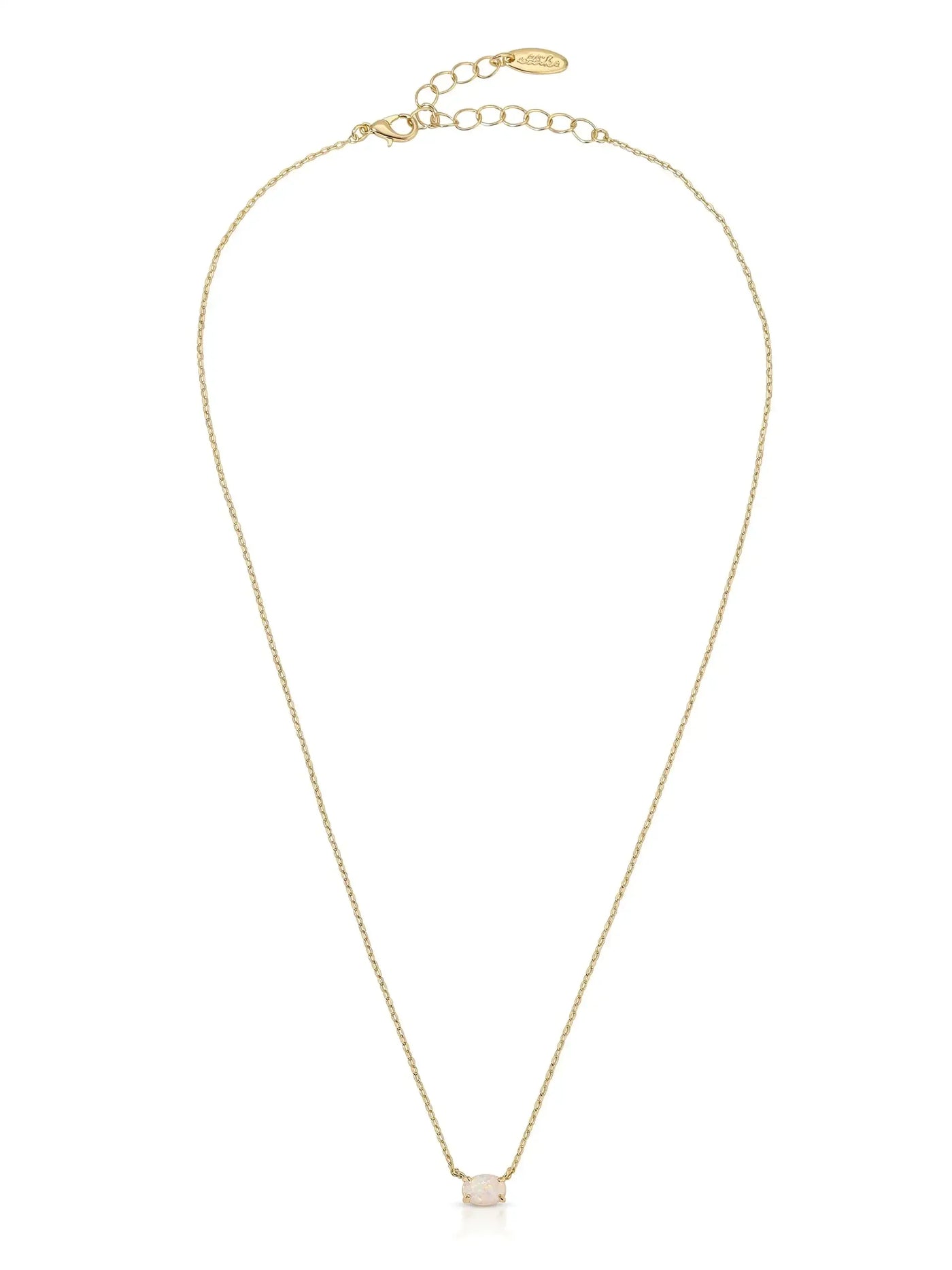 A delicate gold necklace features a single decorative stone at the center. It hangs gracefully, showcasing its fine chain and minimalist design, suitable for various occasions.