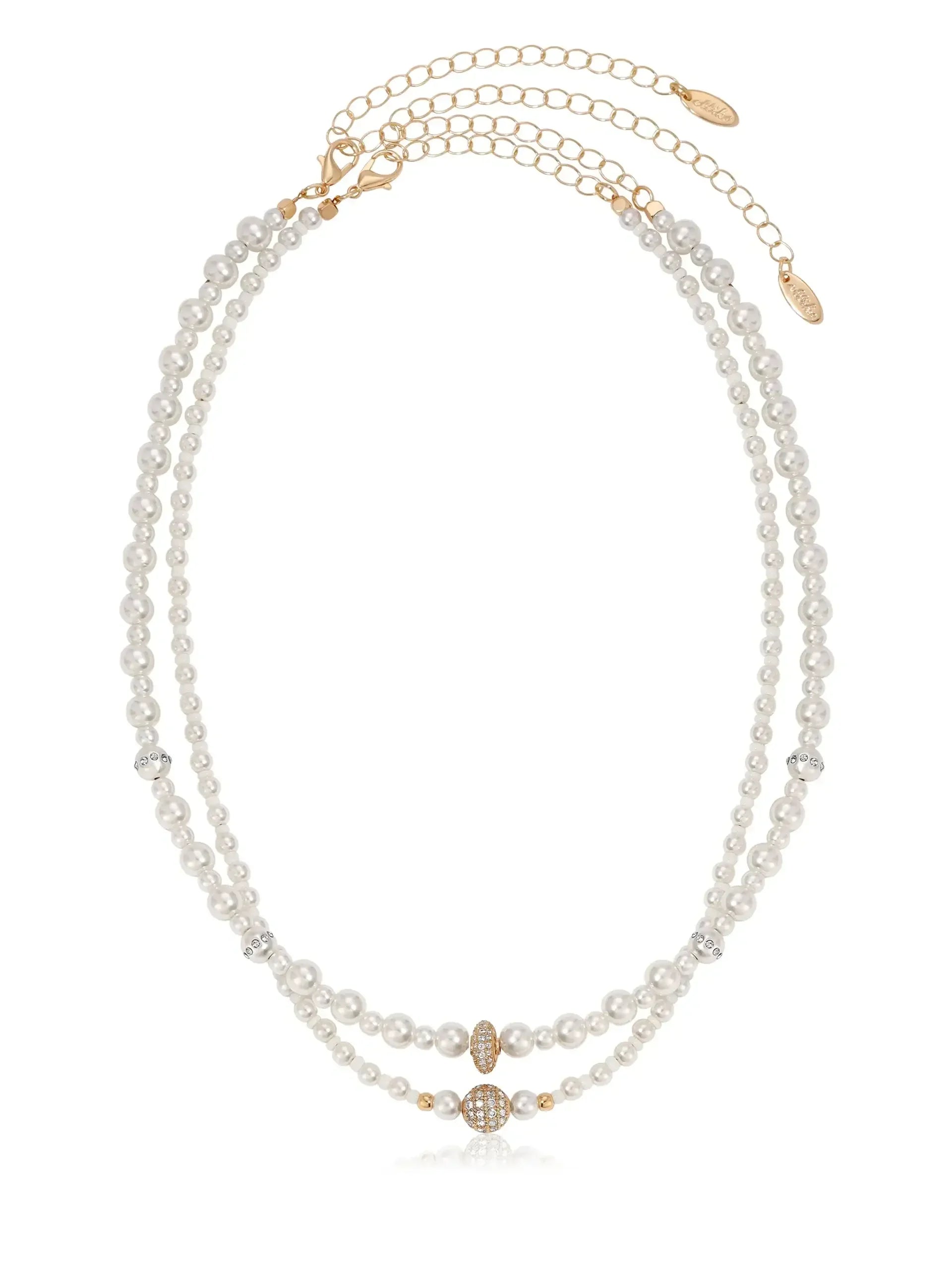 A multi-strand pearl necklace showcases alternating white pearls and decorative gold beads, featuring a sparkling central piece. The elegant design is suspended from a delicate gold chain.