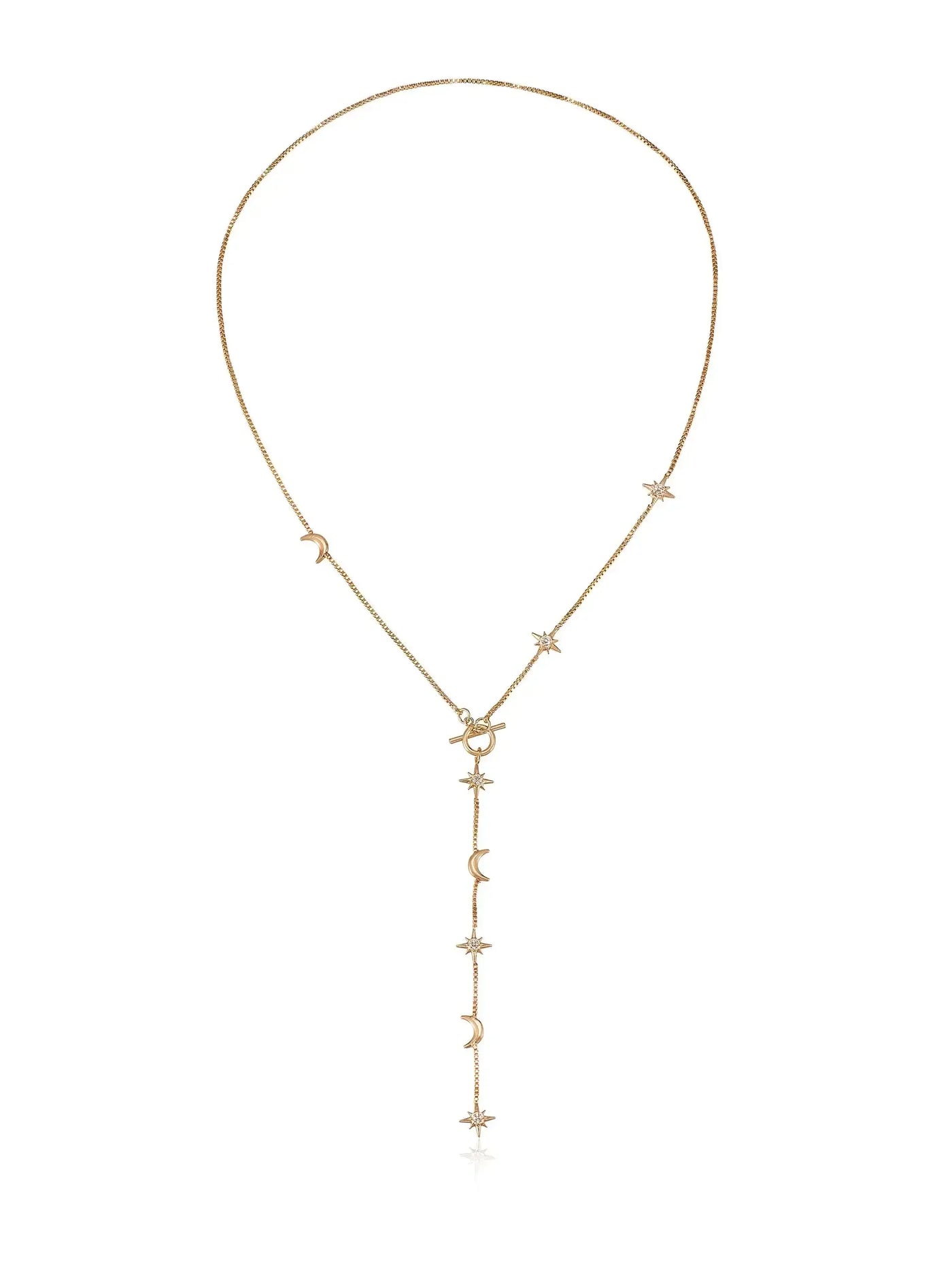 A delicate gold necklace features celestial-themed charms, including stars and moons, elegantly hanging from a fine chain. The design creates an enchanting flow, suitable for various outfits.