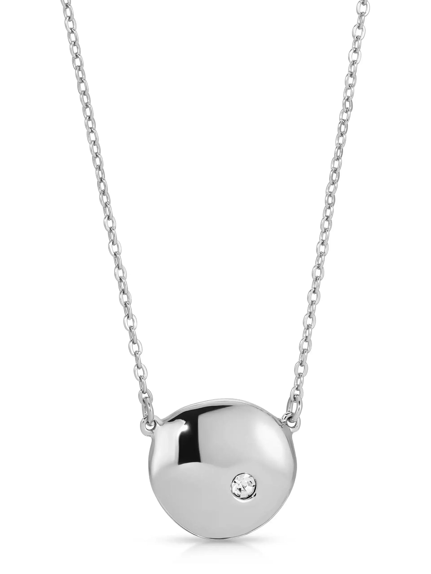 A silver pendant necklace features a smooth, oval charm with a small, sparkling gemstone. It hangs from a delicate chain, creating an elegant and minimalist accessory.