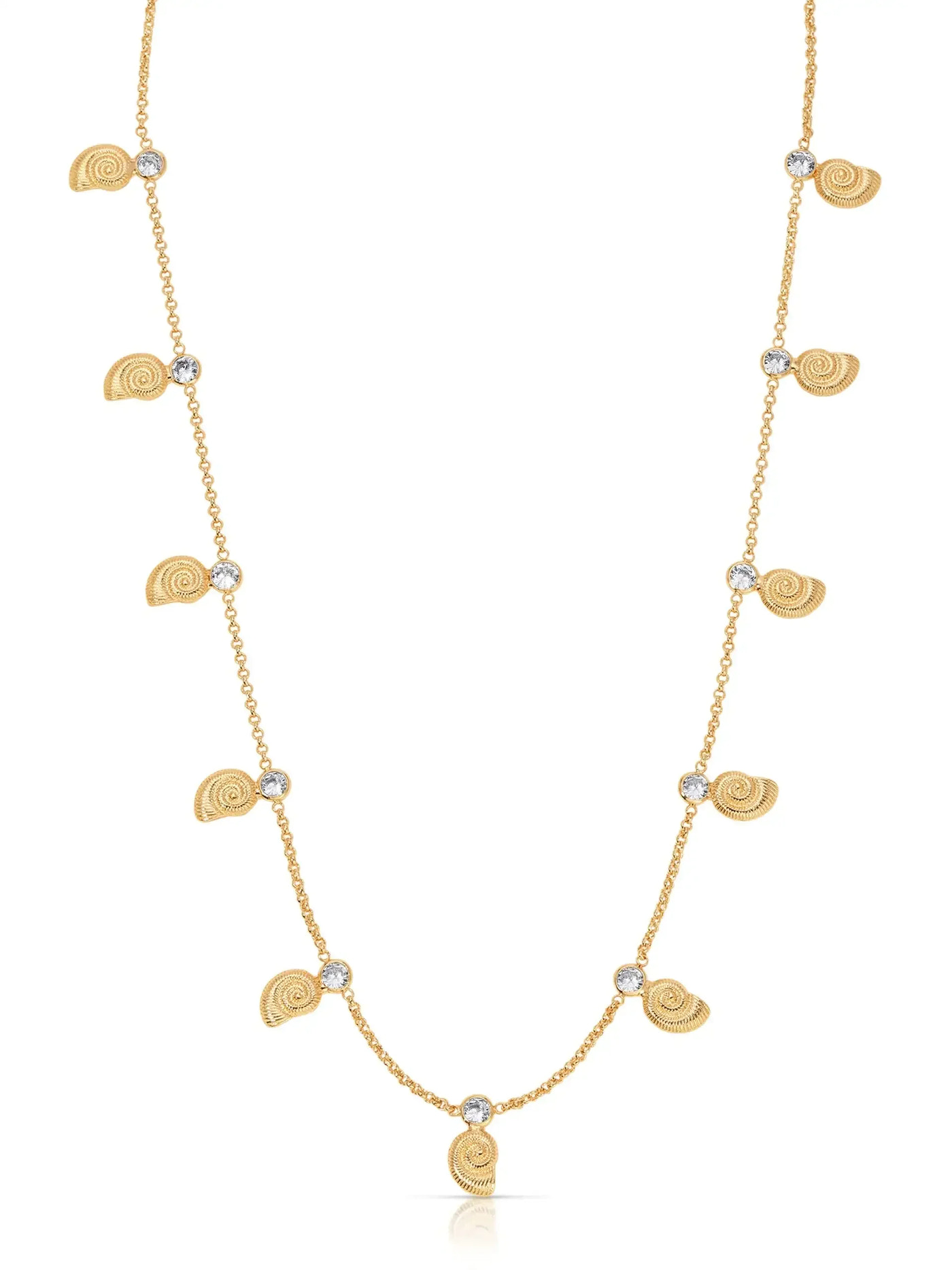 A gold necklace features small spiral shell pendants alternating with round, sparkling stones, elegantly hanging in a delicate chain, showcasing a fashionable beach-inspired design.