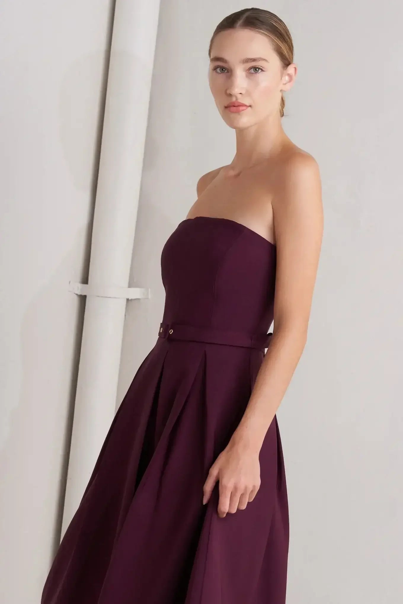 Strapless burgundy dress with a belt