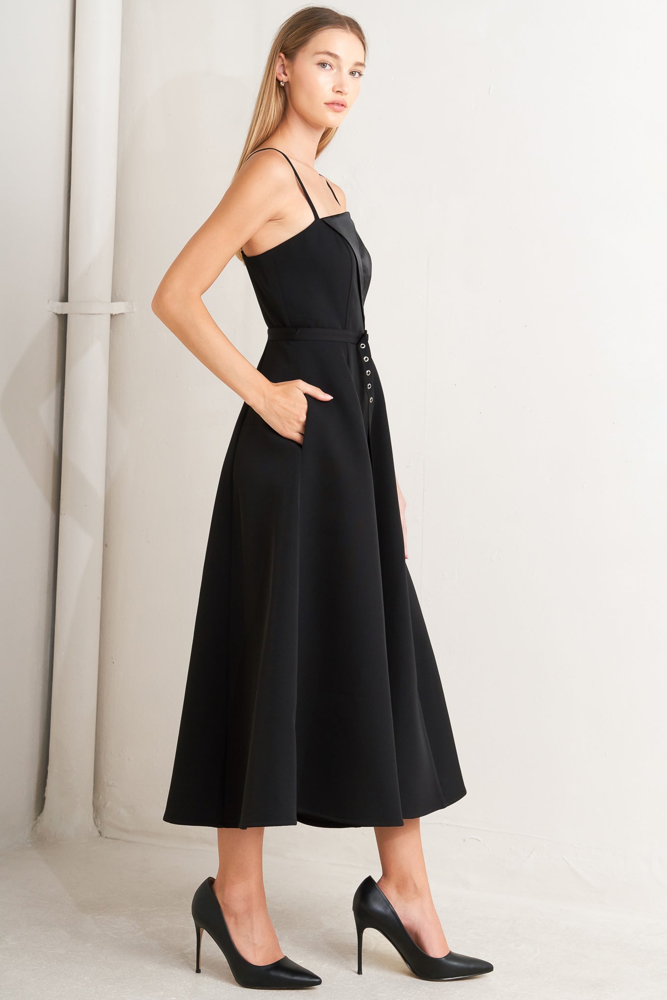 Black dress with a fitted bodice and flared skirt