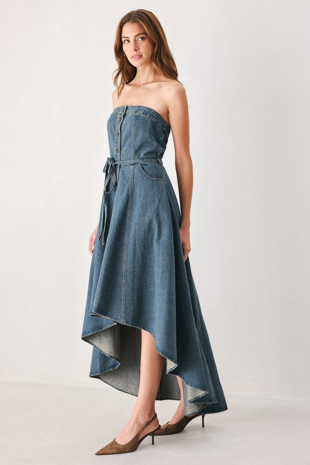 Strapless Button Front High Low Denim Midi Dress in Medium Indigo, side view of high-low hem | Lady Black Tie
