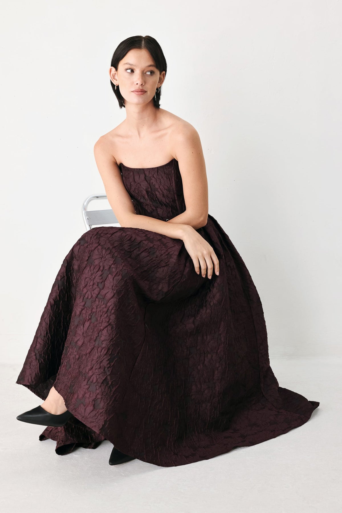 Burgundy Strapless Jacquard Midi Dress with Pockets in Burgundy, seated view | Lady Black Tie