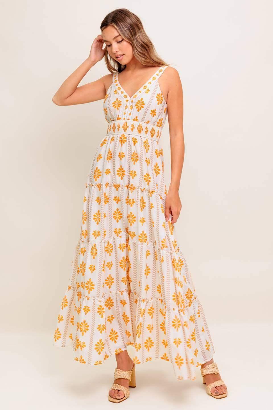 White dress with yellow floral patterns