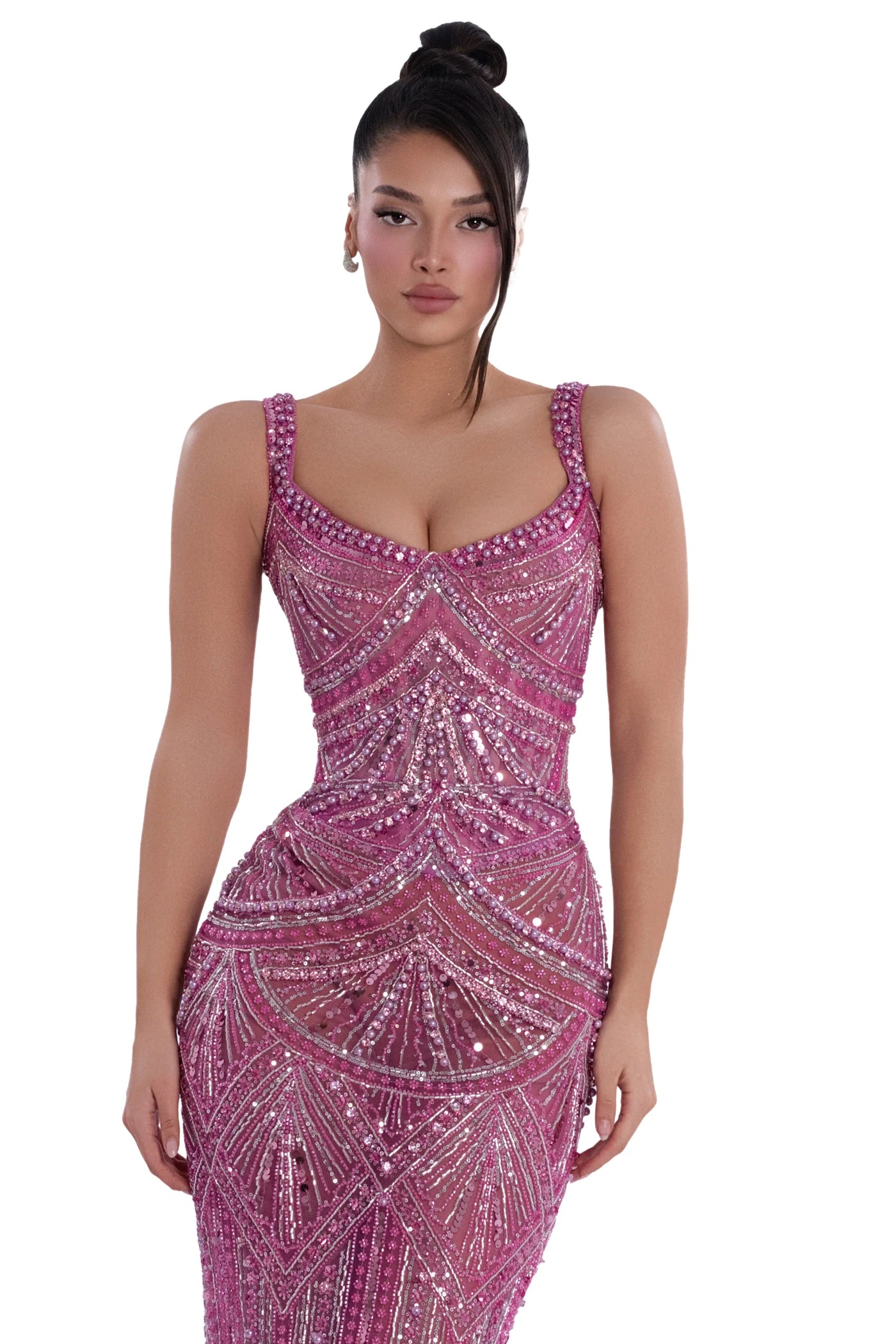 Woman wearing a pink beaded evening gown on a white background