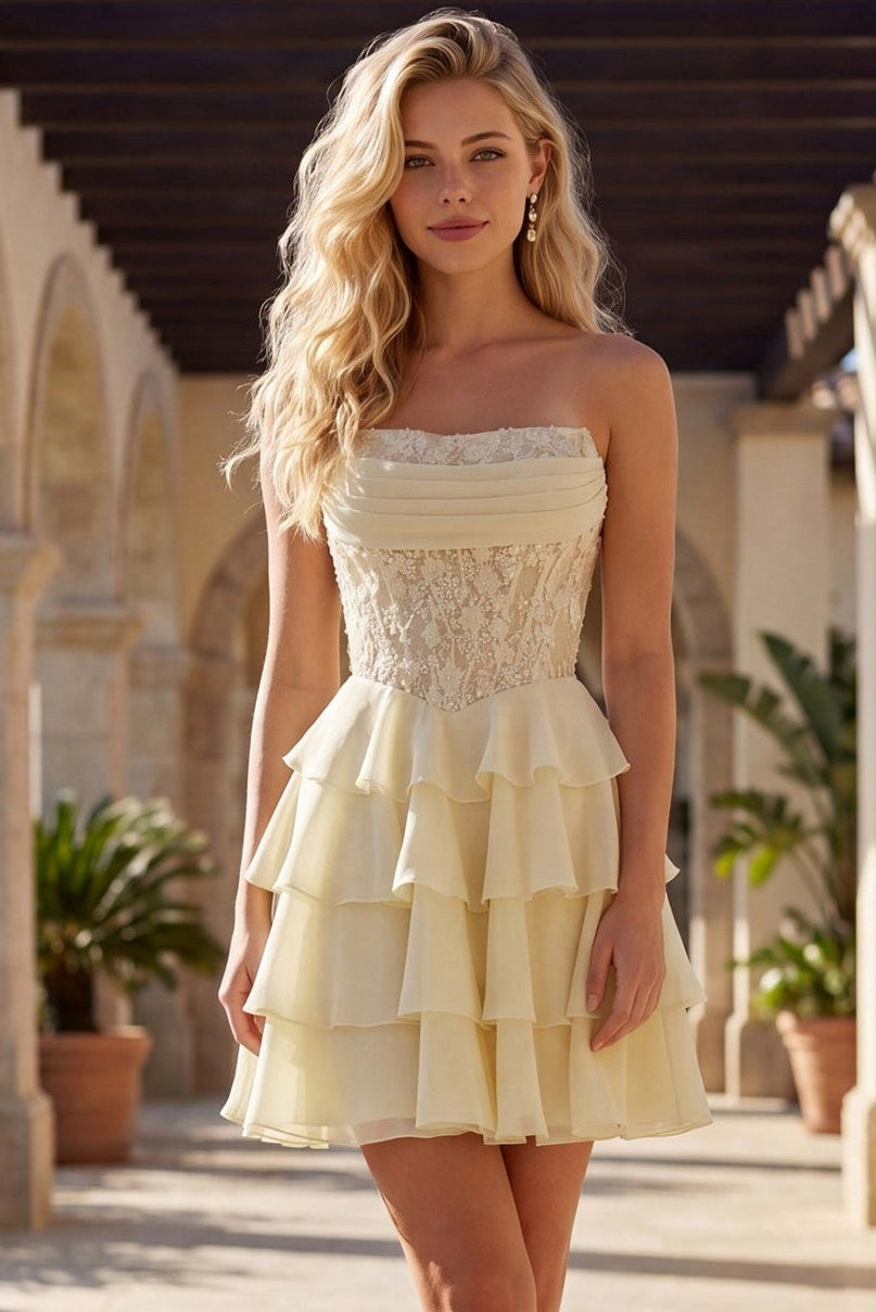 Woman in a yellow dress standing in an outdoor setting with columns and plants.