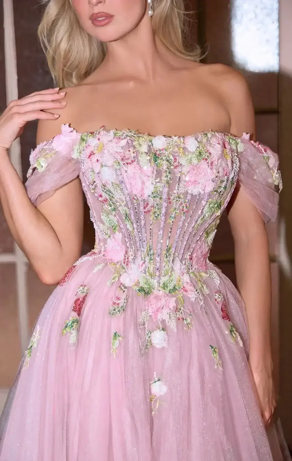 Pink floral gown in an elegant interior setting