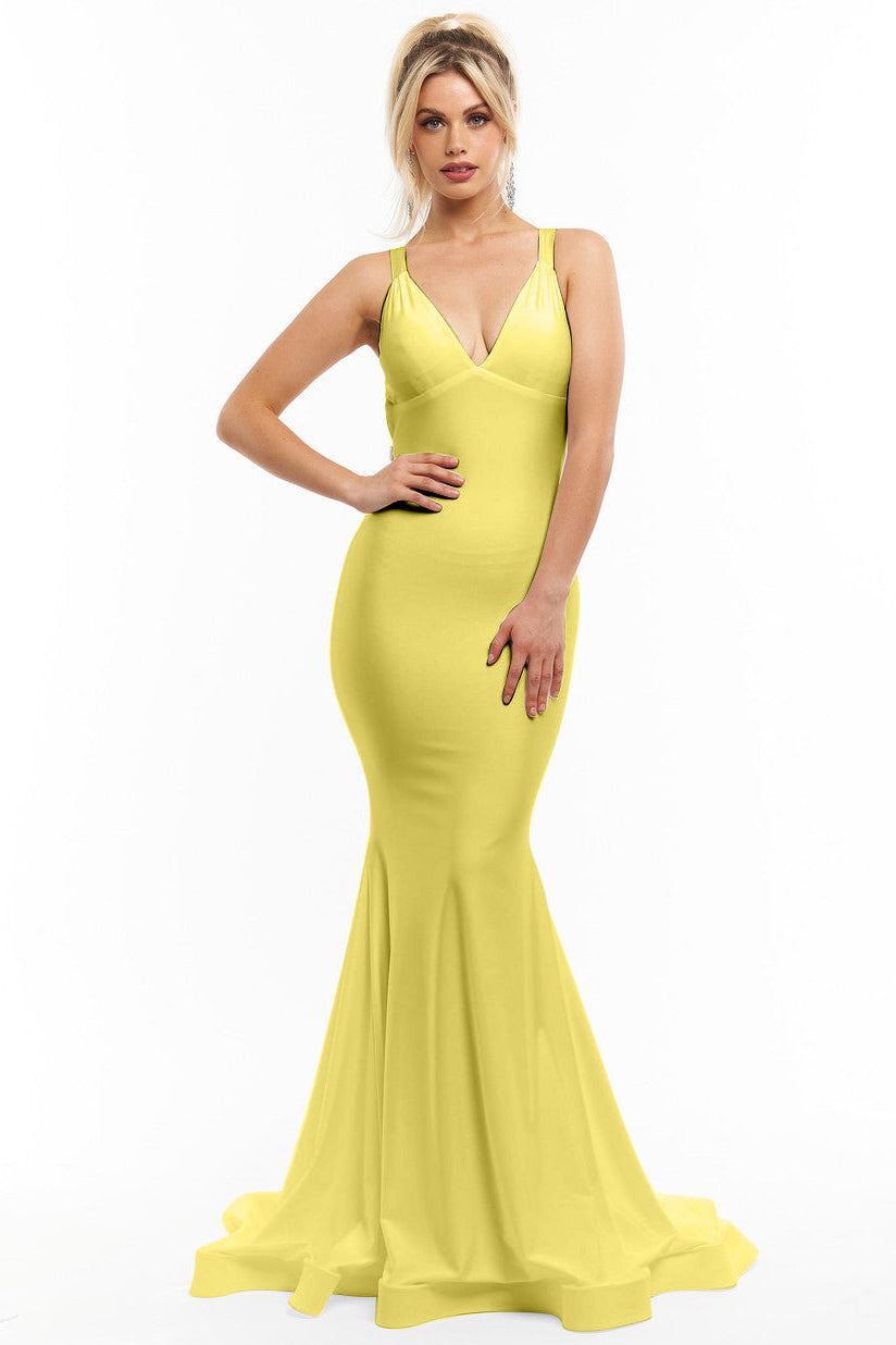 Woman wearing a yellow evening gown on a white background