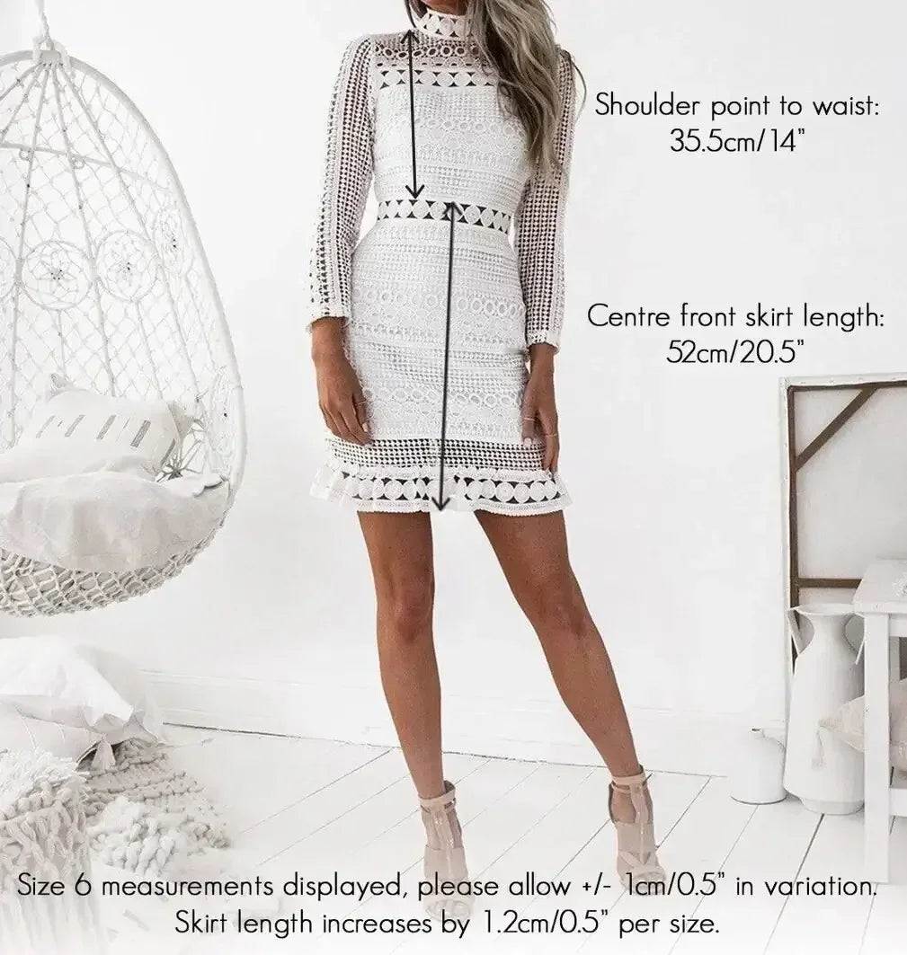 A woman stands wearing a white lace dress with a fitted silhouette. Measurements for shoulder point to waist and skirt length are annotated nearby. A hanging chair and decor enhance the light, airy environment.